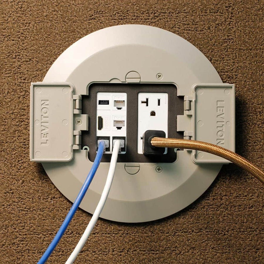 Boîte de plancher en passage continu installée dans une pièce tapissée